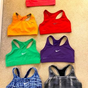 7 Nike Sports Bras.  Non impact, med, unlined and great fitting and condition.